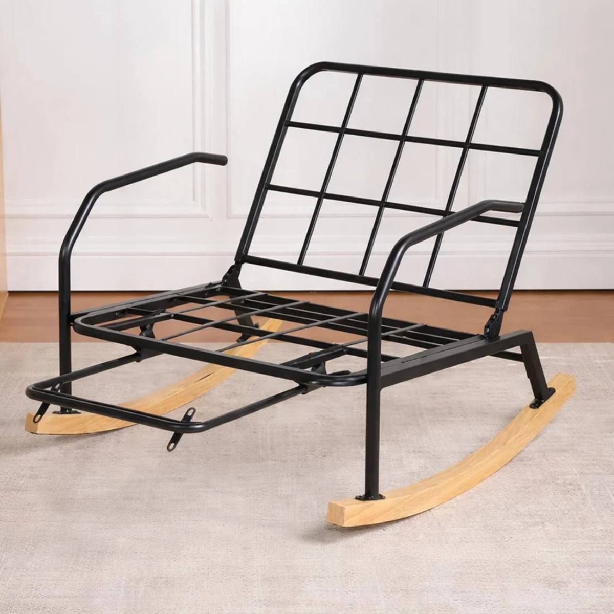 Black metal and wooden rocking chair on a neutral background