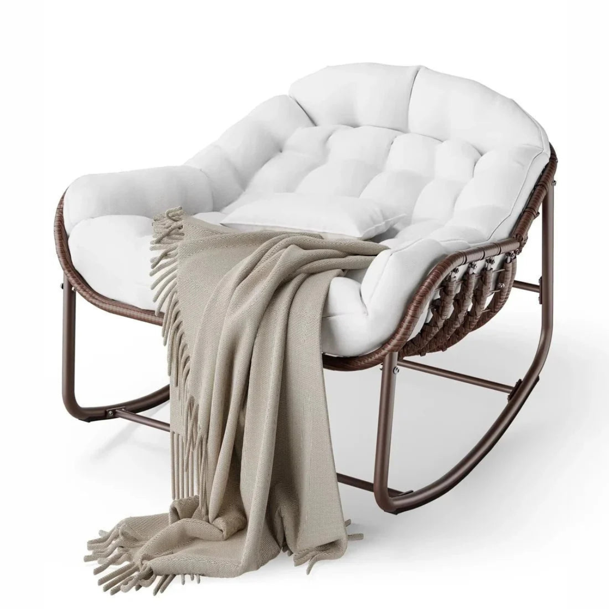 White cushioned rocking chair with a beige blanket on a white background