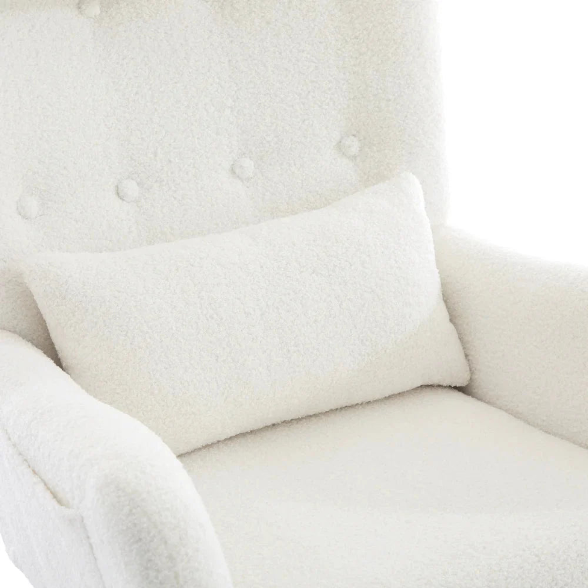 A white textured bouclé accent pillow resting on a matching white bouclé armchair.