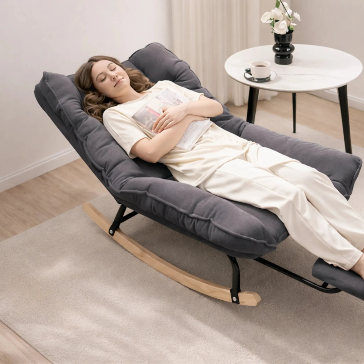 Woman relaxing on a modern rocking chair in a cozy living room.