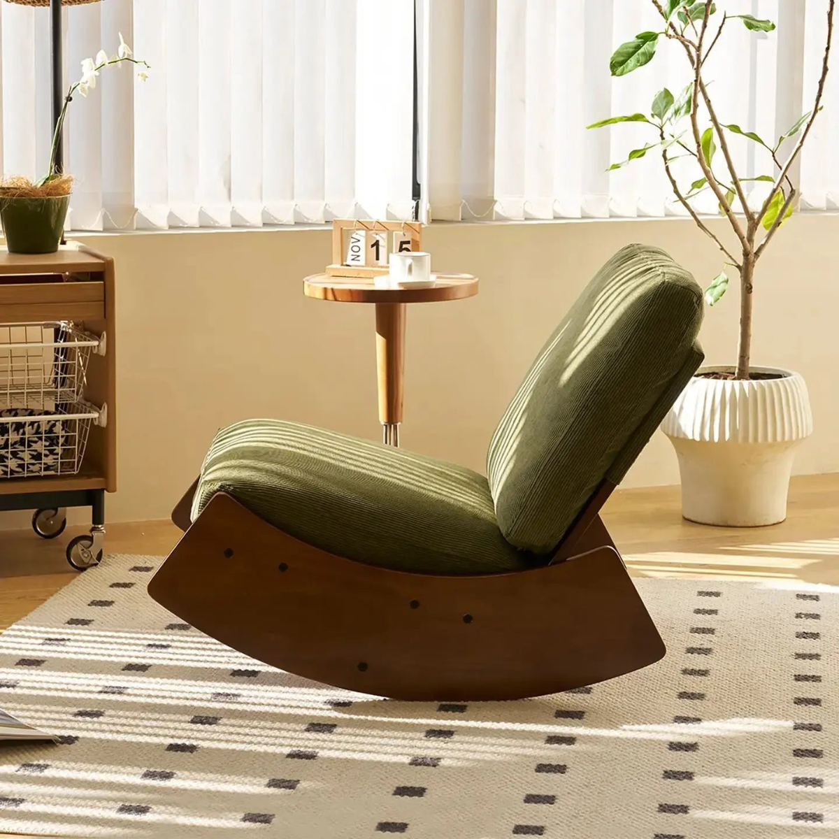 Modern rocking chair in a room with plants and a small table.