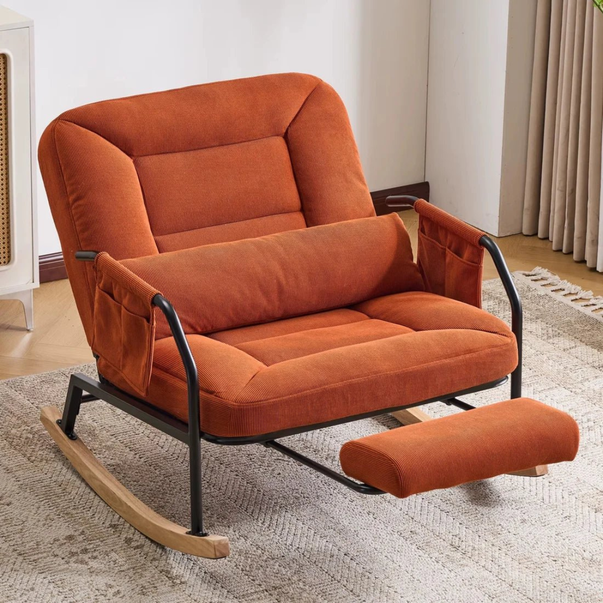 Orange rocking chair with footrest in a room setting