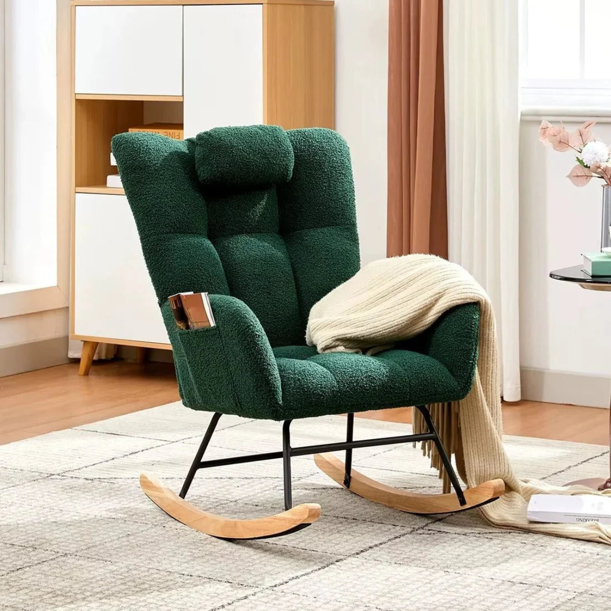 Green rocking chair with wooden base in a room setting