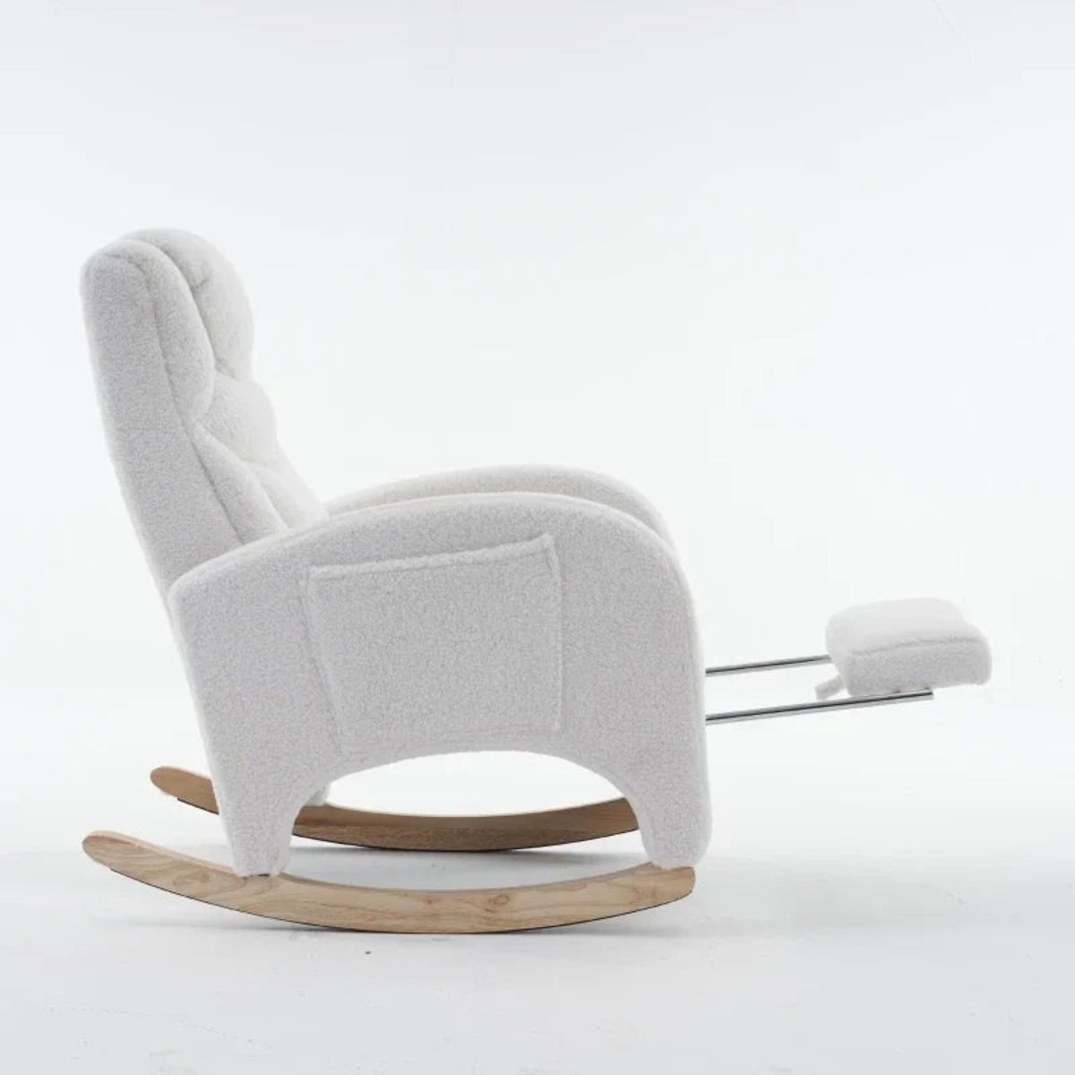 A modern white upholstered rocking chair with a matching footrest and natural wood rockers, photographed against a seamless white studio background.
