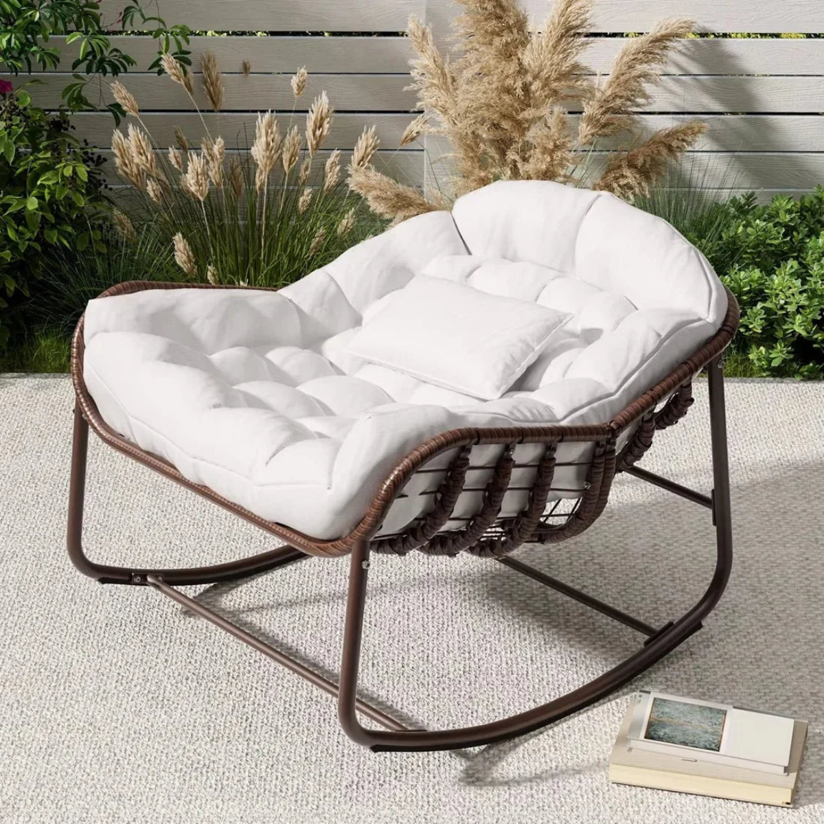 Wicker chair with white cushion on a patio