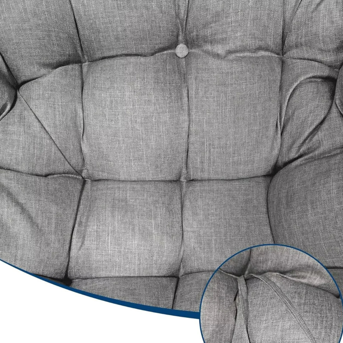 Close-up of a gray tufted upholstered chair cushion with a circular inset showing fabric texture detail.
