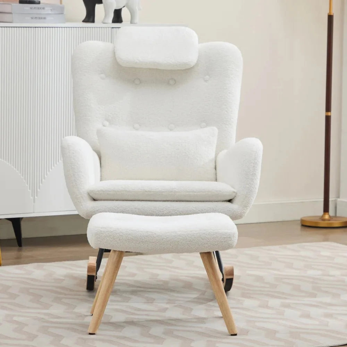 White armchair with wooden legs and matching ottoman in a room setting.