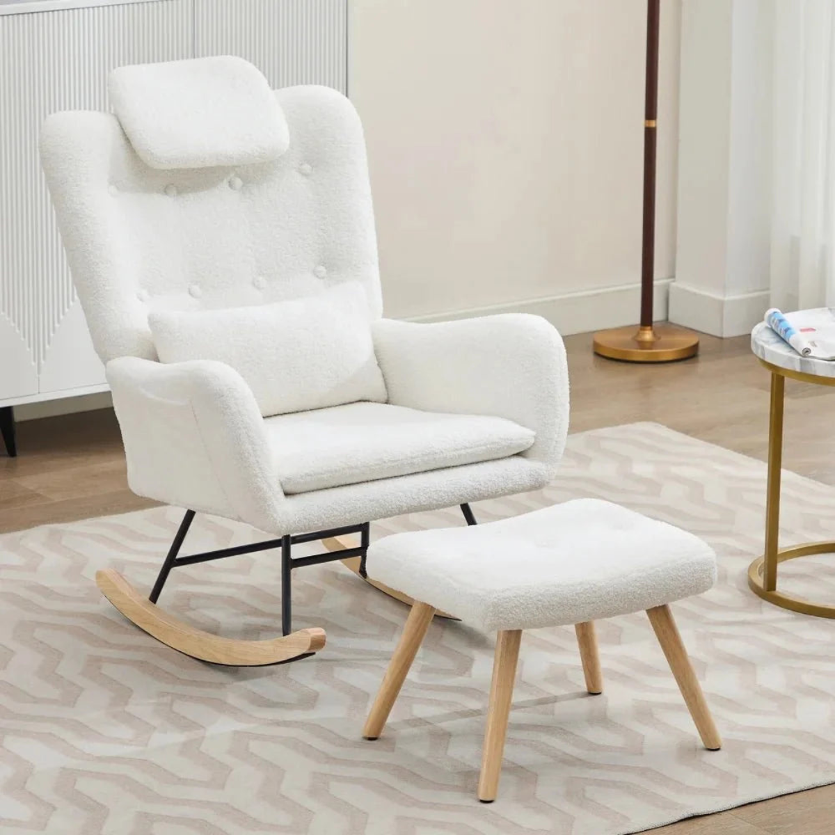 A white bouclé rocking armchair with a matching ottoman in a bright, modern room setting.